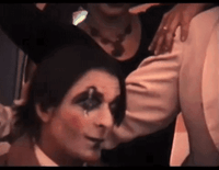 Sam Phipps βSluggoβ Wearing Makeup For The Mystic Knights of the Oingo Boingo,Tucking His Hair Behind His Ear GIF